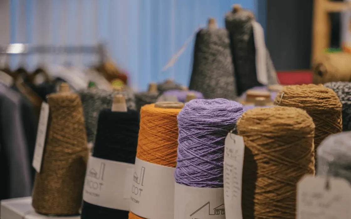 Colourful yarn cones displayed for textile material review