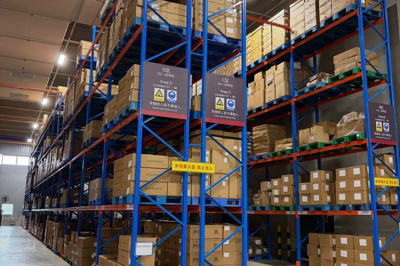 Warehouse racks holding organized cartons for quality review